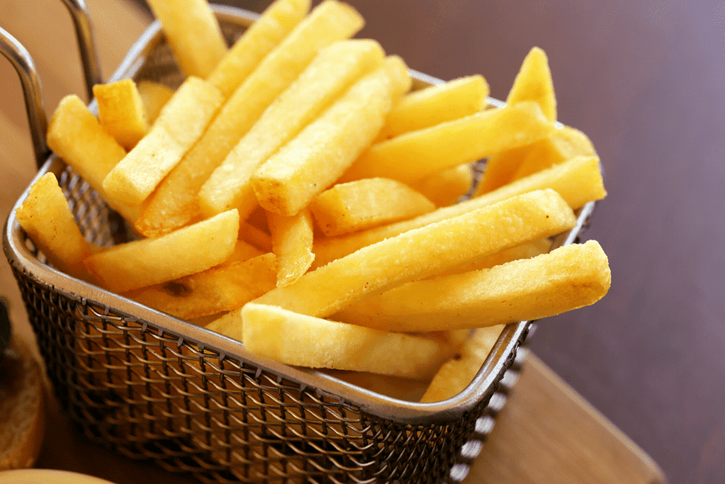 a basket of unhealthy french fries 