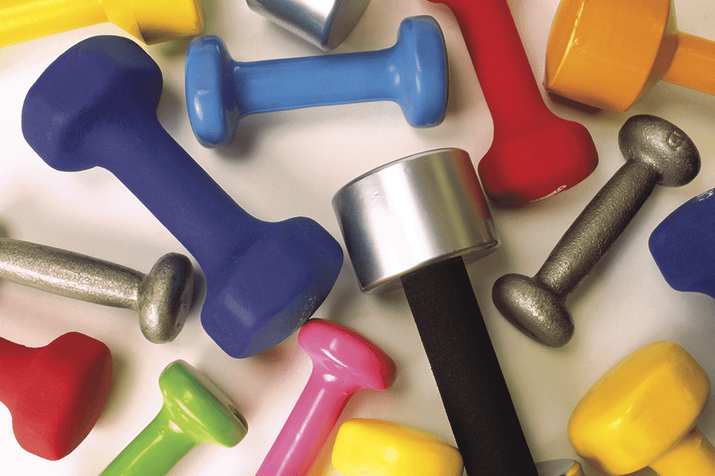 a number of colorful dumbbells