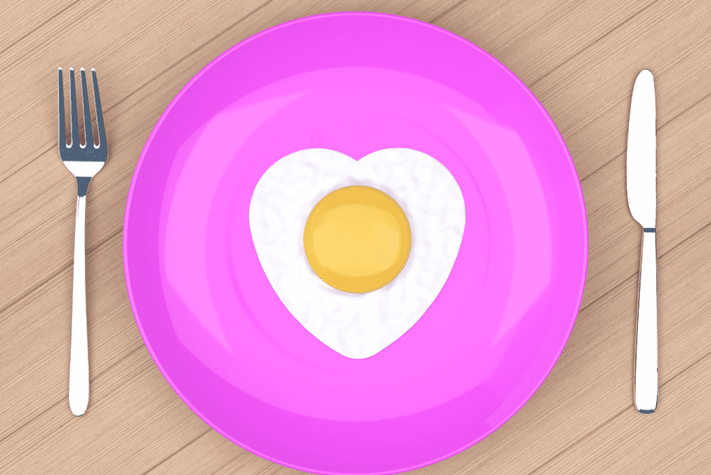 heart fried egg on pink plate